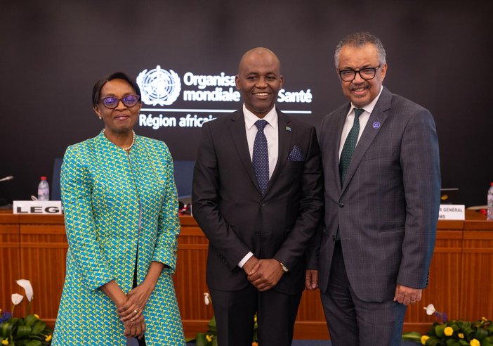 Dr. Faustine Engelbert Ndugulile stands with Dr Moeti, present Regional Director of WHO AFRO and Dr Tedros Adhanom Ghebreyesus, WHO Director-General