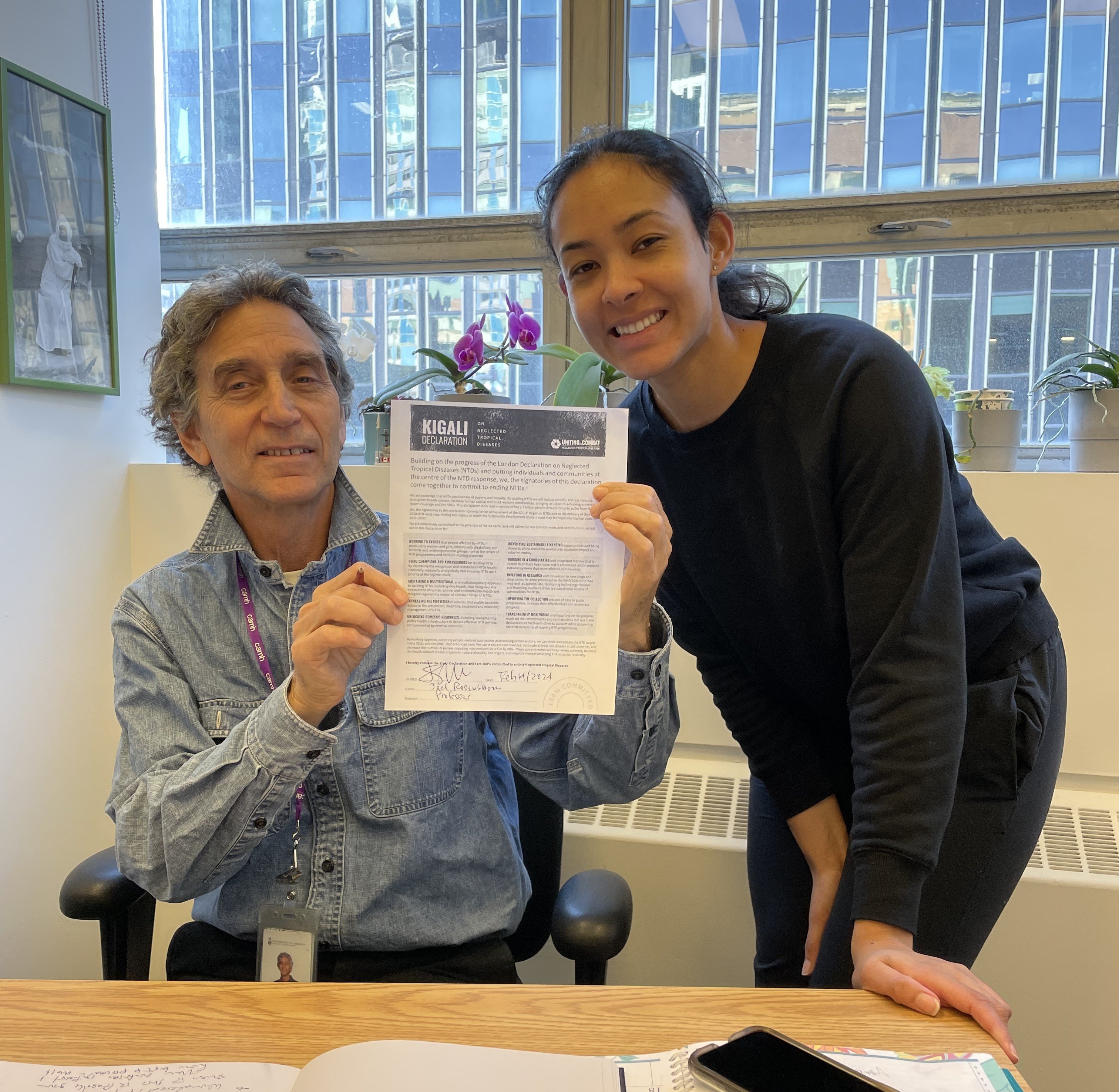 Noma Action Group hold up a signed Kigali Declaration on NTDs