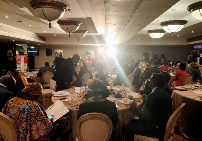 Ministers sit around tables ready for side event